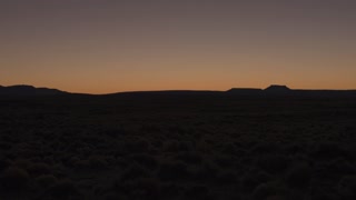 videoblocks-aerial-low-angle-flying-low-above-the-bushy-desert-at-dawn-before-the-sunrise_r0mpfzjtgz_thumbnail-small14